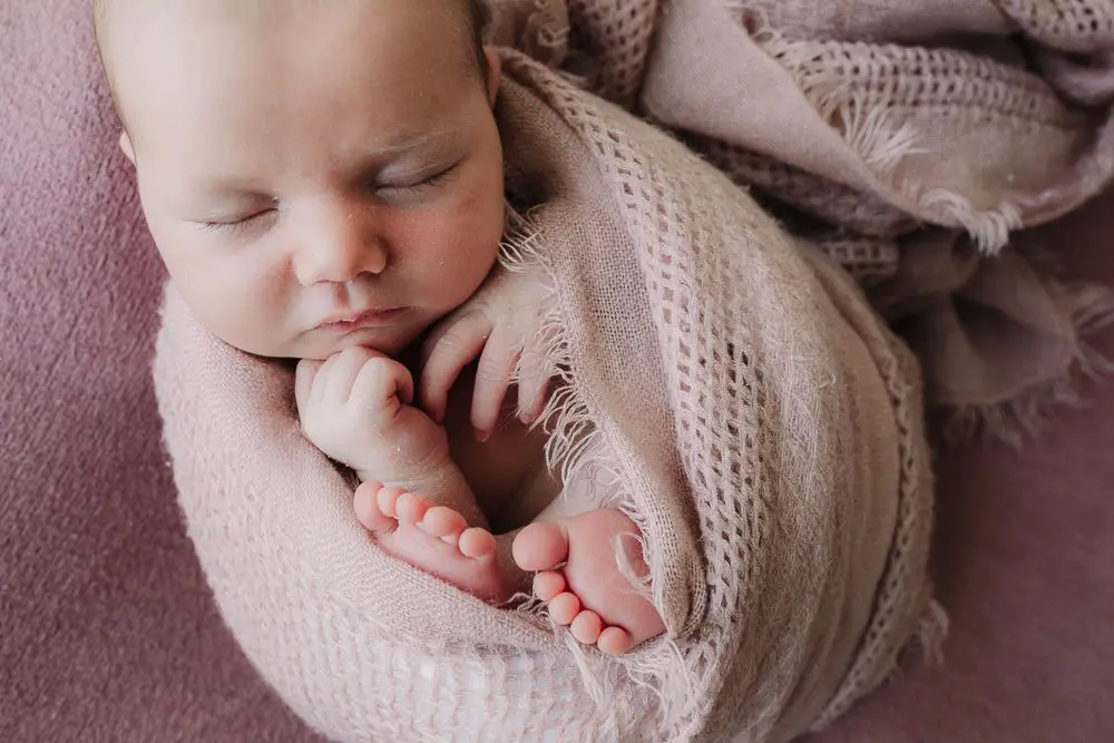 Newborn photography course baby girl wrapped in scarf