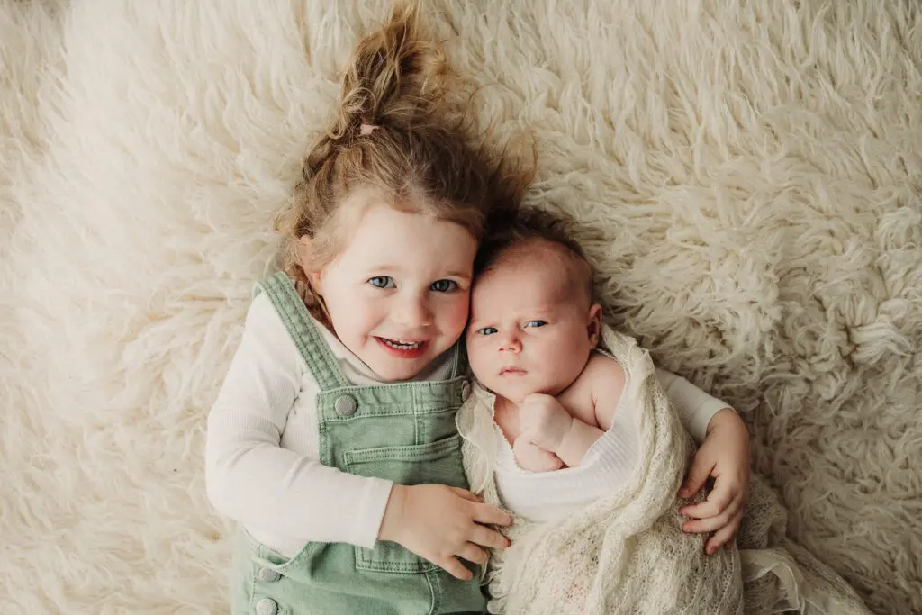 newborn and sibling pose photography