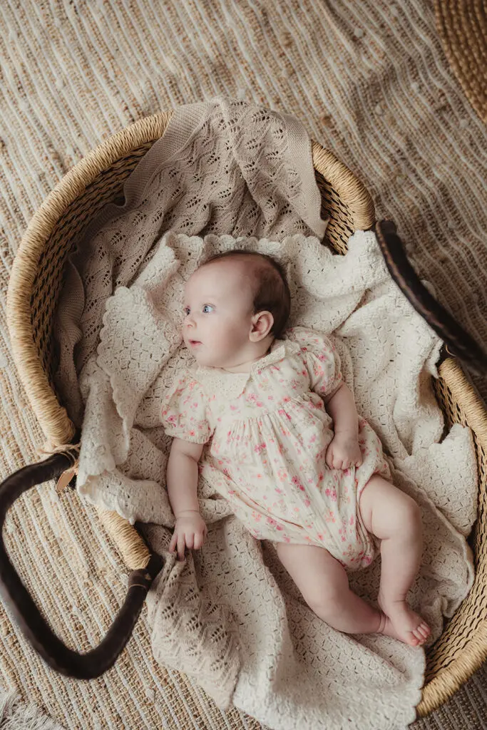 small basket neutral blanket newborn baby small space