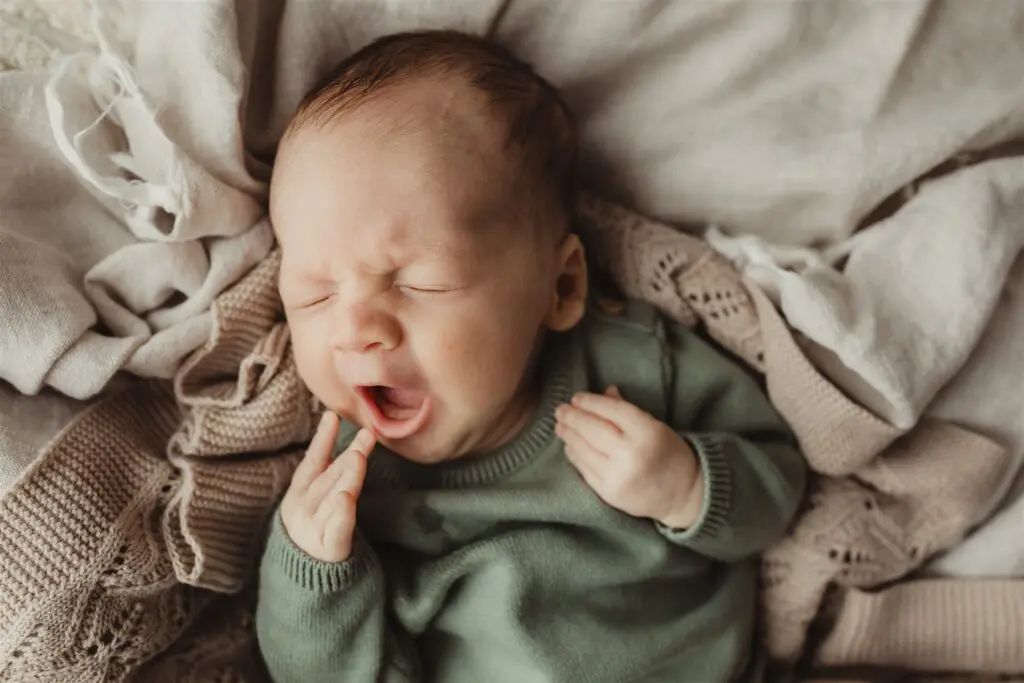 newborn photography emotions yawning