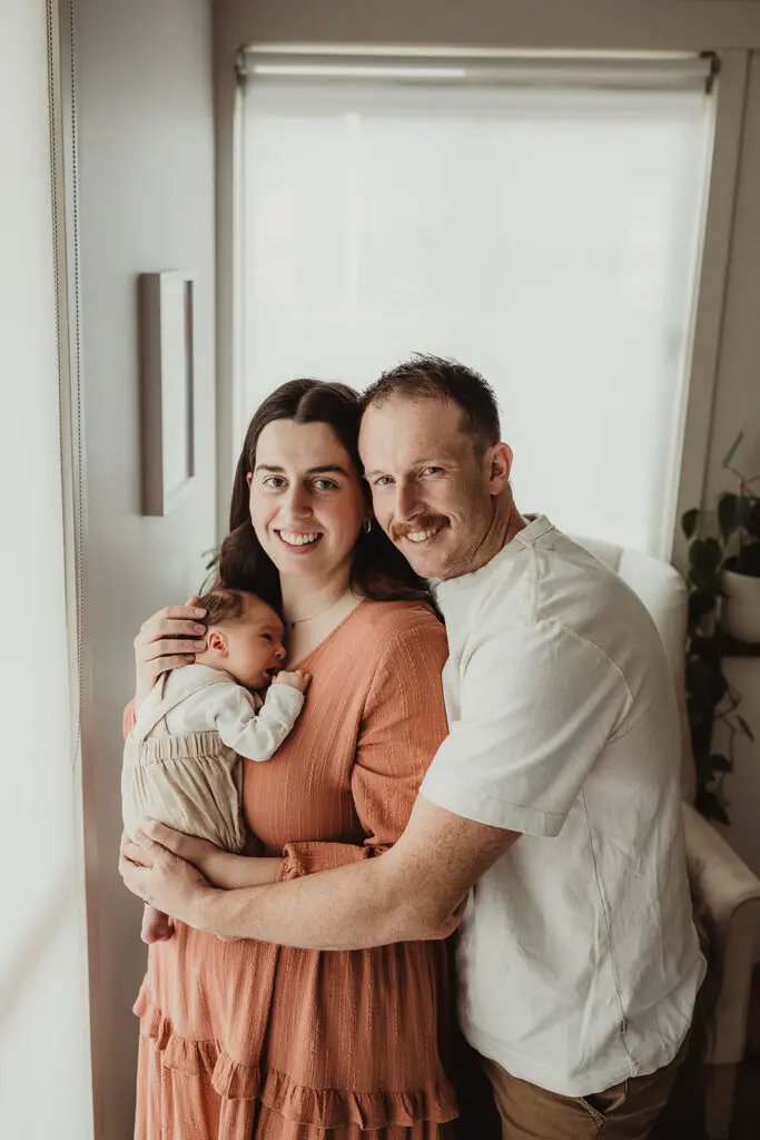 choosing newborn outfit for photos