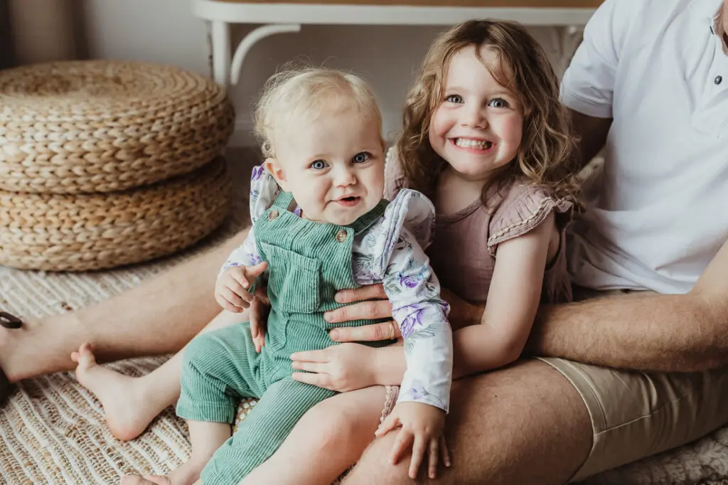 sibling and baby pose photo