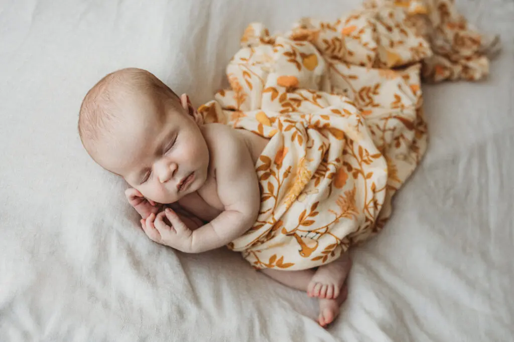 neutral blanket draped for newborn photoshoot