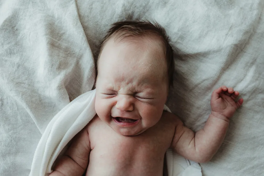 calm a crying baby first for photos